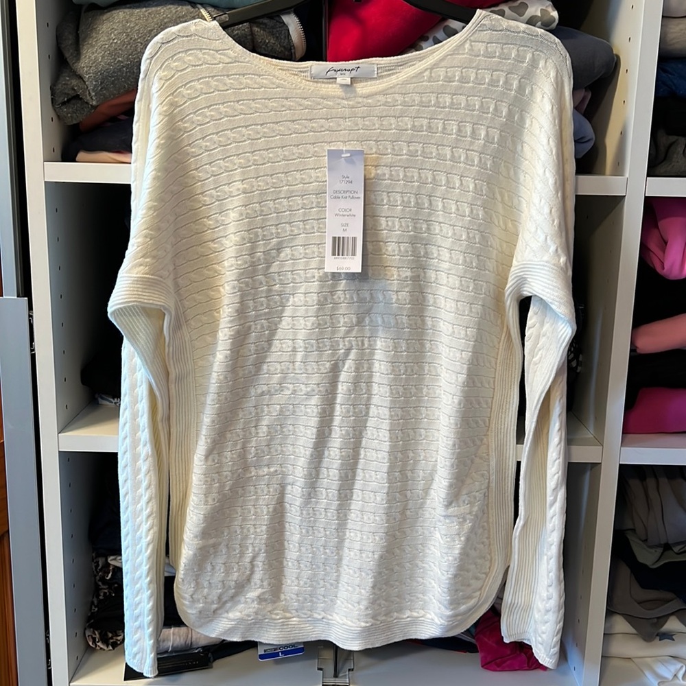 Cable knit pullover sweater.